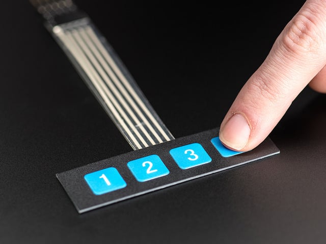 Finger pressing a button of 1x4 flexible  keypad