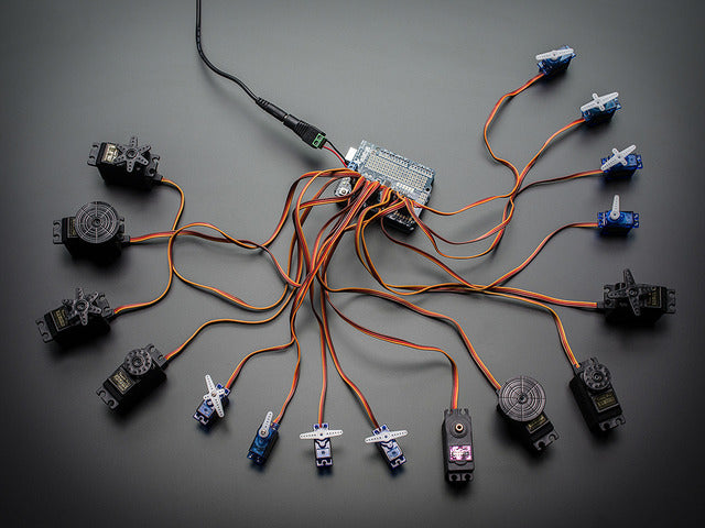 Top down view of a Adafruit 16-Channel 12-bit PWM/Servo Shield - I2C interface connected to 16 servos. 