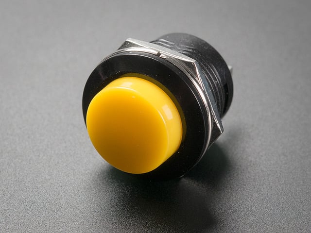 Angled shot of 16mm yellow panel mount pushbutton.