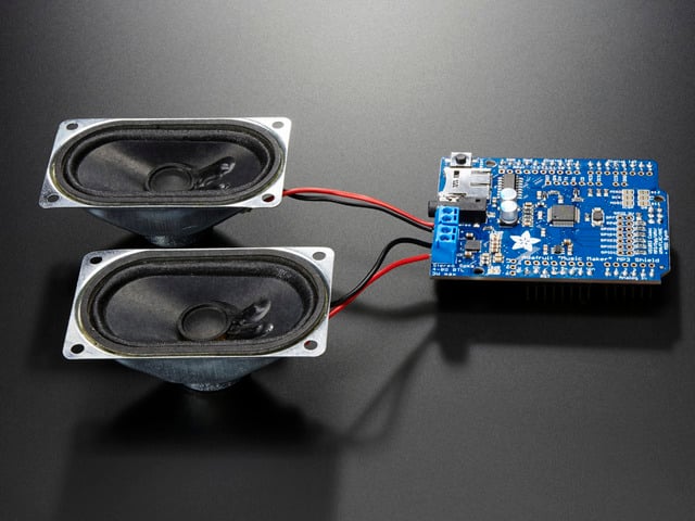 Adafruit "Music Maker" MP3 Shield for Arduino w/3W Stereo Amp connected to a set of speakers. 