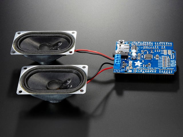3W Stereo Amp connected to a set of speakers. 