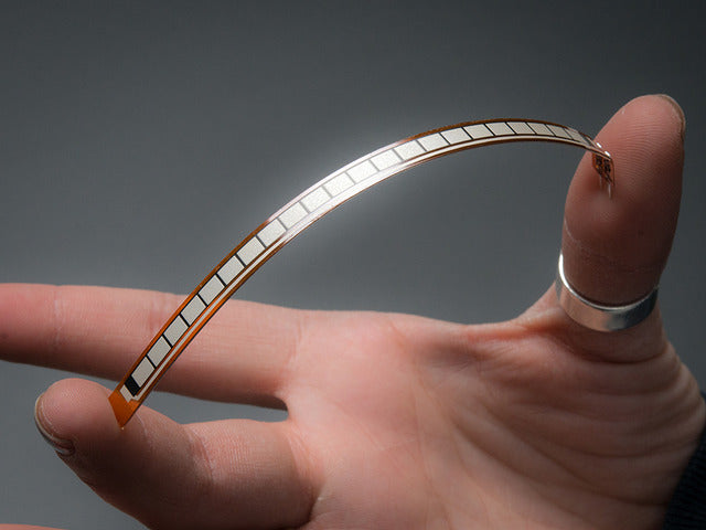 Hand bending Long Flex sensor between two fingers