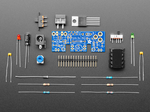 Unassembled kit shot with PCB, various components, chips, resistors, etc.