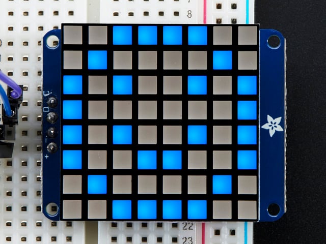 I2C Backpack assembled and powered on. A blue graphic smiley is displayed.