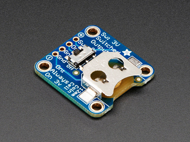 Angled shot of a 12mm Coin Cell Breakout Board with On-Off Switch.