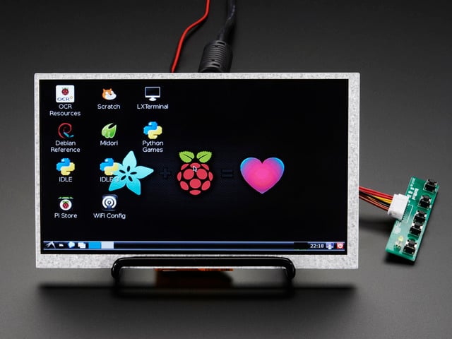 Mini Driver. The monitor displays a desktop background with a adafruit logo, raspberry logo, and a heart. 