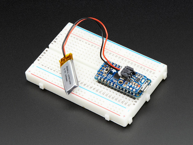 LiPoly Backpack soldered onto a Pro Trinket, plugged into a solderless breadboard.