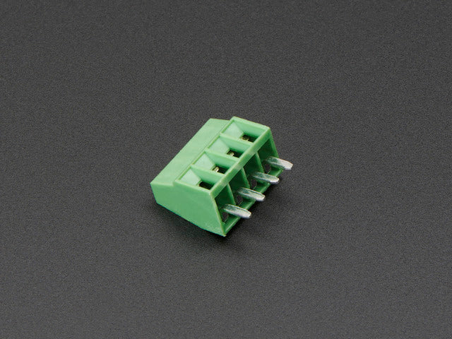 Angled shot of green 4-pin 2.54mm terminal block.