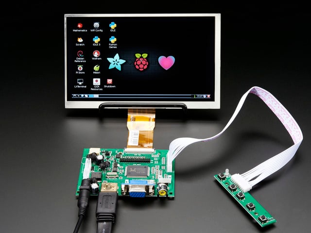 Front shot of a HDMI 4 Pi: 7" Display. The monitor displays a desktop background with a adafruit logo, raspberry logo, and a heart. 