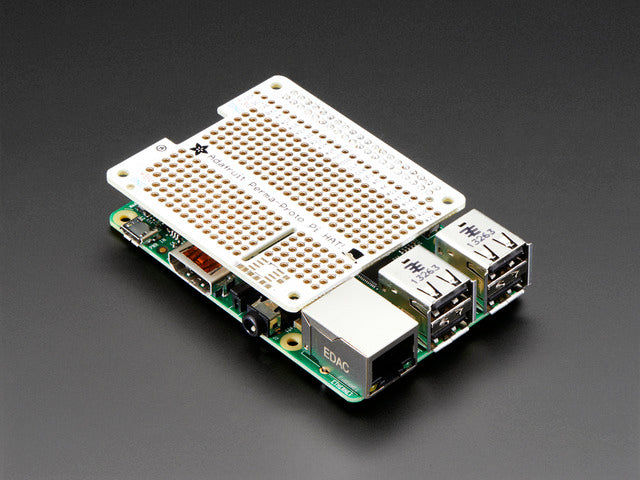 Angled shot of Adafruit Perma-Proto HAT for Pi Mini Kit on a Raspberry Pi.