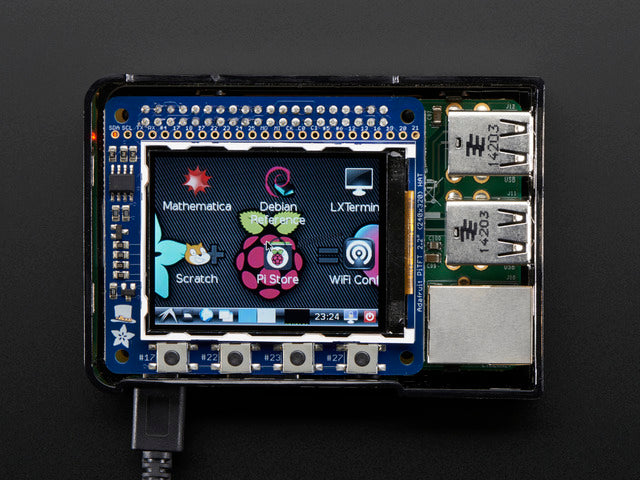 Top down view of a Adafruit PiTFT 2.2" HAT Mini Kit with desktop image on the display. 