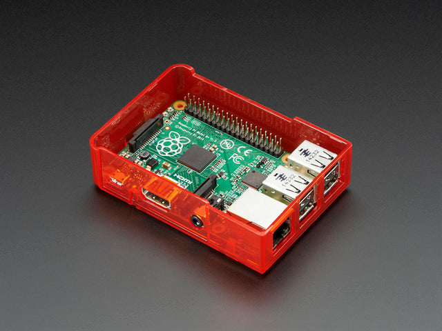 Assembled red acrylic Raspberry Pi case with no lid.