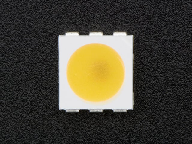 Top down view of a 5050 Warm White LED w/ Integrated Driver Chip. 