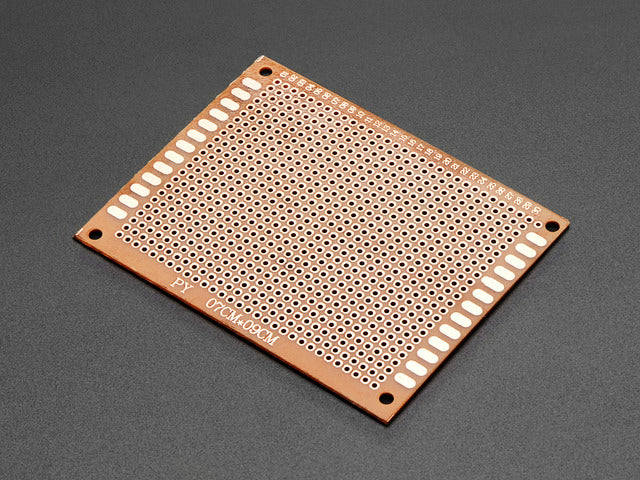 Angled shot of single Bakelite Universal Perfboard Plate.