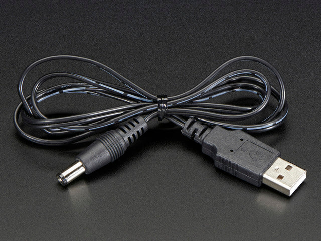 Shot of a coiled USB to 2.1mm Male Barrel Jack Cable.