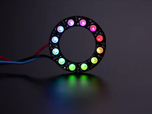 NeoPixel Ring with 12 x 5050 RGBW LEDs lighting up rainbow and white