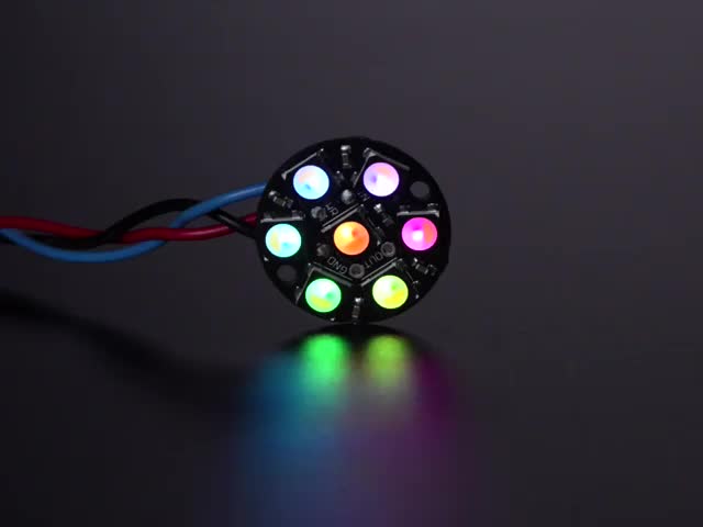 NeoPixel Jewel - 7 x 5050 RGB LED wired to Trinket, lit up rainbow and white