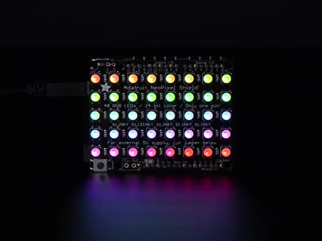 Adafruit NeoPixel Shield for Arduino - 40 RGB LED Pixel Matrix lit up rainbow and warm white.