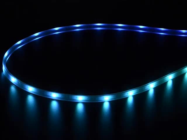 Adafruit NeoPixel Digital RGB LED Strip wired with all the LEDs illuminating various colors. 