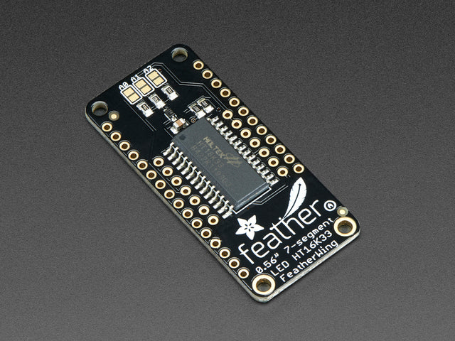 Angled shot of a Adafruit 4-Digit 7-Segment LED Matrix Display FeatherWing. 