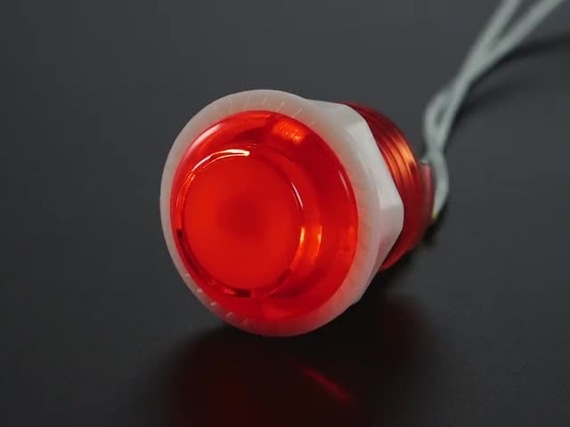 Video of 24mm mini translucent red LED arcade button flashing on and off.