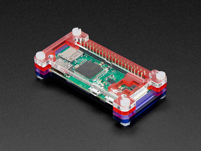 Angled shot of an assembled Pibow Zero W Case on a Raspberry Pi Zero. 