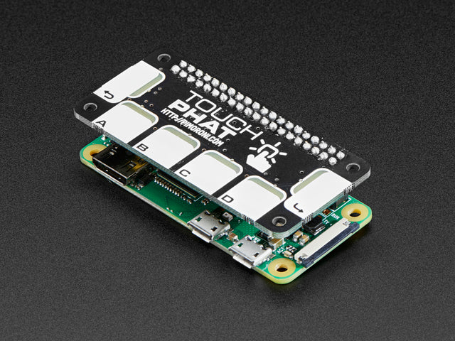 Angled shot of a Pimoroni Touch pHAT for Raspberry Pi Zero stacked on a Pi Zero. 