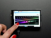 Red polished finger scrolling through the adafruit website on a Pimoroni HyperPixel - 4.0" Hi-Res Display for Raspberry Pi. 