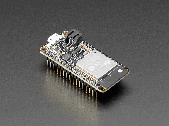 Angled shot of rectangular microcontroller with headers. 