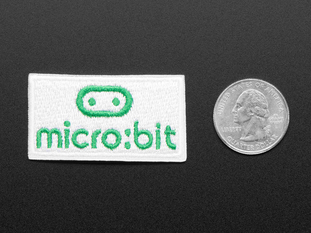 Rectangular shaped embroidered badge with the micro:bit logo in green over a white background
