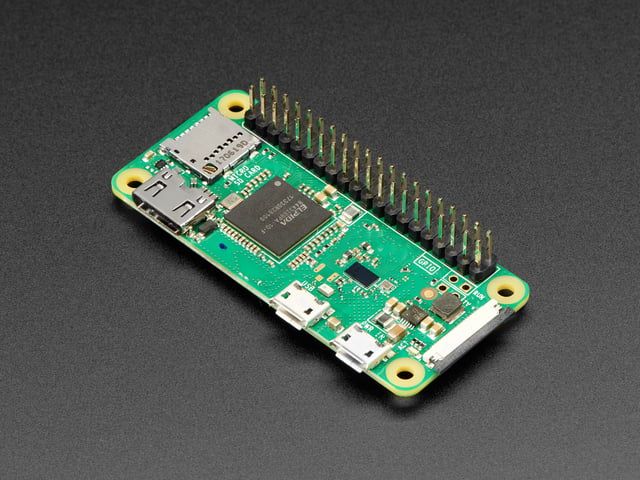 Angled shot of Raspberry Pi Zero W computer with headers.