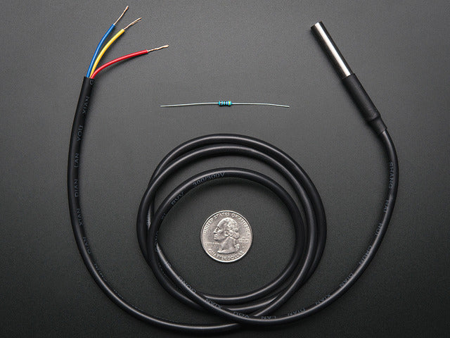 Waterproof 1-Wire DS18B20 Compatible Digital temperature sensor coiled around a US quarter and a resister above it. 