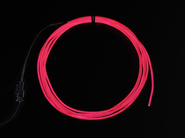 Coil of lit EL wire in pink