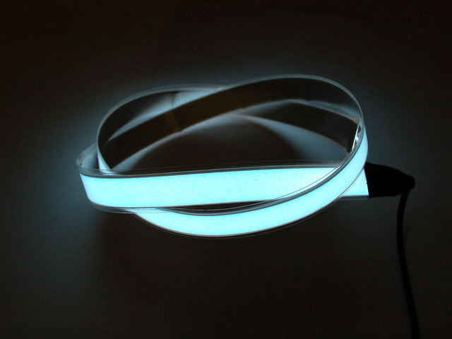 Coil of lit white Electroluminescent Tape Strip 