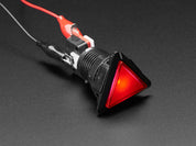 Angled shot of a red triangle illuminated LED pushbutton. 