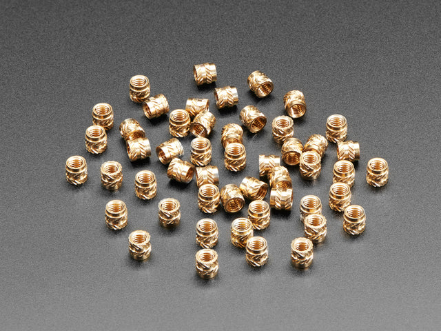 pile of 50 Brass Heat-Set Inserts for Plastic - M3 x 4mm.