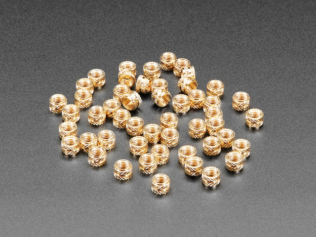 pile of 50 Brass Heat-Set Inserts for Plastic - M3 x 3mm.