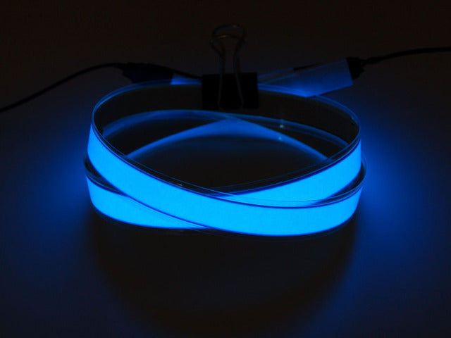 Coil of lit blue Electroluminescent Tape Strip 