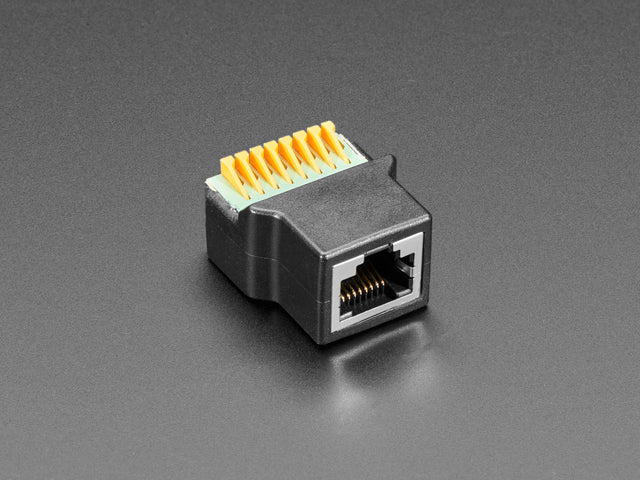 Angled shot of RJ-45 Ethernet Female Socket to Terminal Spring Block Adapter.