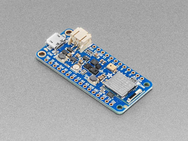 Angled shot of blue, rectangular, microcontroller.