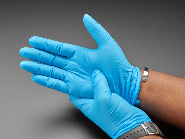 Blue nitrile gloves show being worn