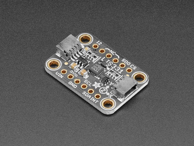 Angled shot of a Adafruit LIS331 Triple-Axis Wide-Range ±24g Accelerometer.