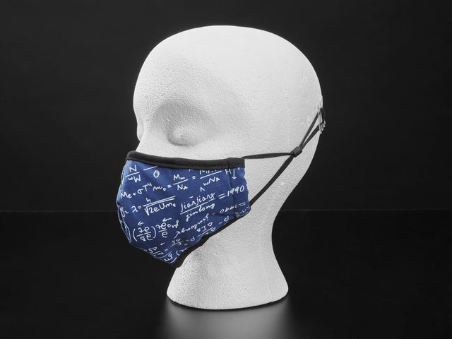 Blue cloth face mask with math equations written in white shown on a mannequin