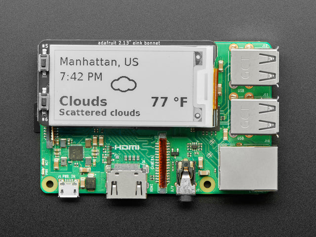 Raspberry Pi computer with E-Ink bonnet attached, displaying weather