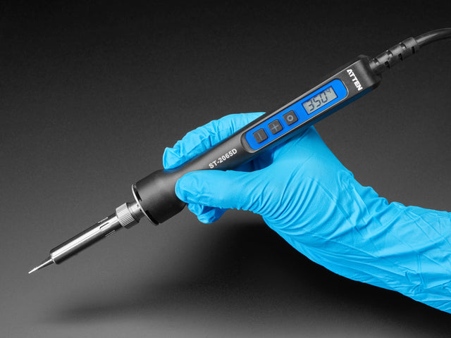 Hand holding Pen type soldering iron with 350 on LCD