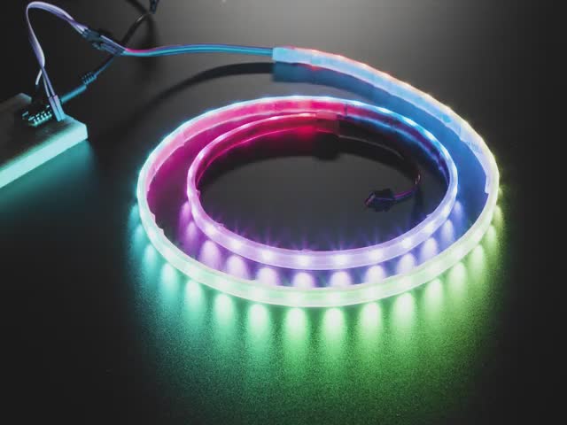 Video of powered-on NeoPixel strip 1 meter long running rainbow LED example code.