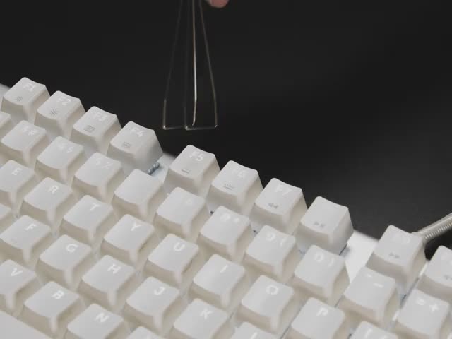 Video of key puller being used to pull out a keycap on a full size keyboard.