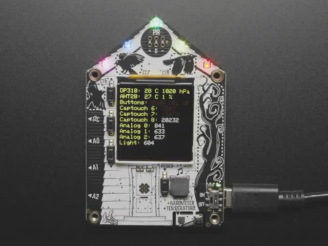 Top-down video of Adafruit Funhouse PCB. The TFT display shows a data readout, and the NeoPixel LEDs glow rainbow colors.