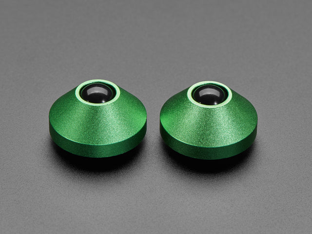 Angled shot of two green aluminum bumper feet.