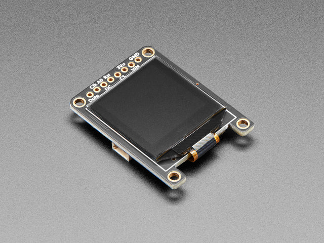 Angled shot of black OLED display breakout board.